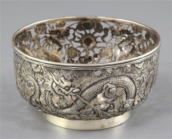 A Chinese silver dragon bowl, late 19th century, diameter 10.7cm